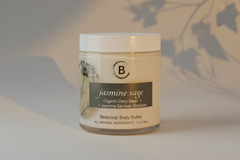 Jar of jasmine sage botanical body butter on a light gray background