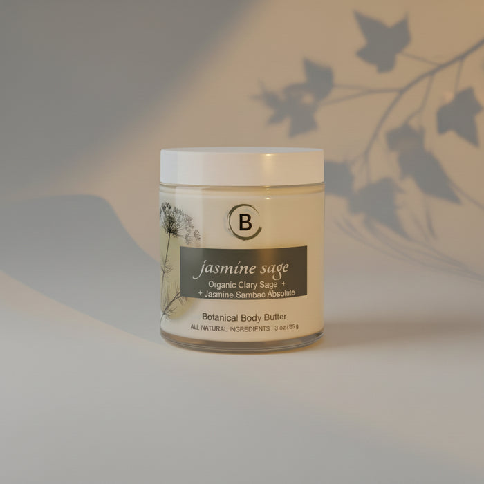 Jar of jasmine sage botanical body butter on a light gray background