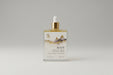 Bottle of 'ROOT' with dropper on a gray background