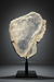 Large Gypsum Selenite Slab on a black stand against a gray background