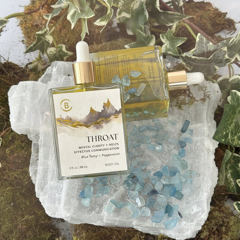 Throat Body Oil Bottle with dropper on selenite, moss and ivy
