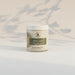 Jar of 'ultra calm' botanical body butter on a marble surface with a light gray background.