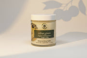 Jar of botanical body butter labeled 'citrus green with light gray background.
